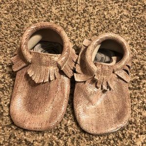 Freshly picked pink and silver moccasins